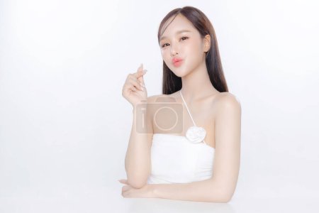 Photo for Young Asian woman long hair with clean fresh skin Korean makeup show love sign on white background, Female model Face care, Facial treatment, Cosmetology, beauty and spa, Asian women portrait. - Royalty Free Image