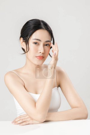 Photo for Asian woman with a beautiful face and Perfect clean fresh skin. Cute female model with natural makeup and sparkling eyes on white isolated background. Facial treatment, Cosmetology, beauty Concept. - Royalty Free Image
