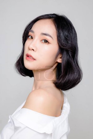 Photo for Asian woman short hair with Perfect clean fresh skin. Cute female model with natural makeup and sparkling eyes on white isolated background. Facial treatment, Cosmetology, beauty Concept. - Royalty Free Image