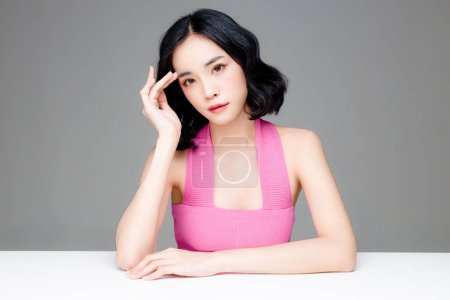 Photo for Asian woman short hair with Perfect clean fresh skin. Cute female model with natural makeup and sparkling eyes on grey isolated background. Facial treatment, Cosmetology, beauty Concept. - Royalty Free Image