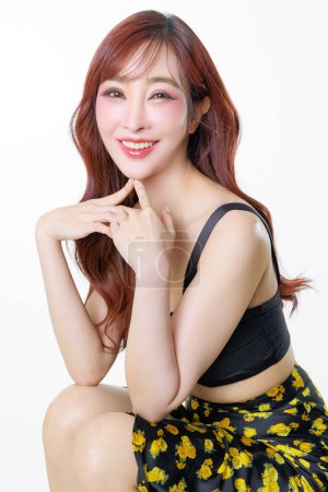 Photo for Asian happy woman with perfect body posing in studio. Luxury fashionable female model in sexy dress with shopping bags on white isolated background. E-commerce, Online shopping Concept. - Royalty Free Image