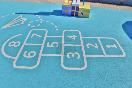 Photo for Hopscotch in a schoolyard. Jumping hopscotch game with numbers - Royalty Free Image