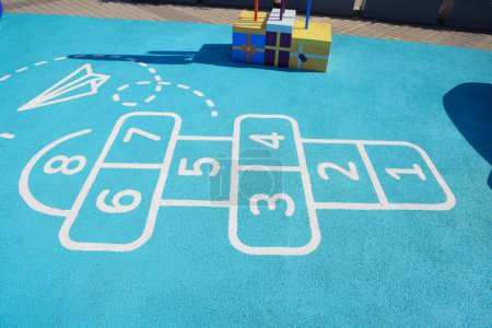 Photo for Hopscotch in a schoolyard. Jumping hopscotch game with numbers - Royalty Free Image