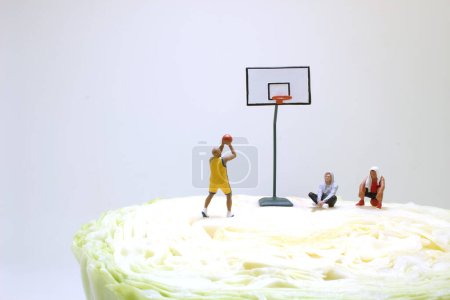 Photo for Fun of figure Basketball street player on Cabbage - Royalty Free Image