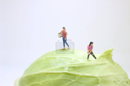 Photo for The fun of figure fit woman in gym on Cabbage - Royalty Free Image