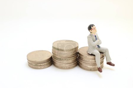 Photo for The Business man siting and chillin on coins - Royalty Free Image