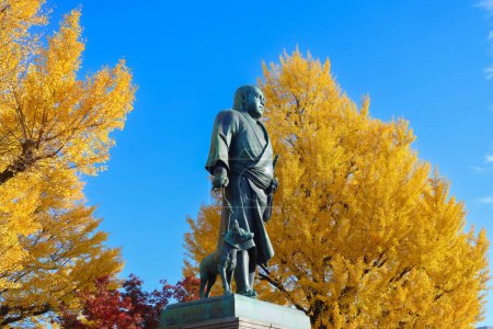 Photo for Ueno park Saigo Takamori statue and yellow autumn Gingo treesNov 30 2023 - Royalty Free Image