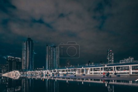 Photo for Dec 31 2023 night landscape of the kai tak avenue park with apartment - Royalty Free Image