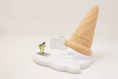 Photo for A Skier skiing downhill white icing on an ice cream cone. - Royalty Free Image