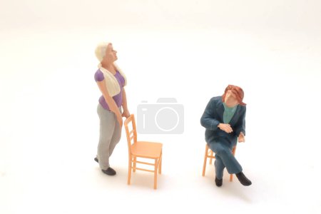 Téléchargez les photos : A figure women meeting with chair on board - en image libre de droit