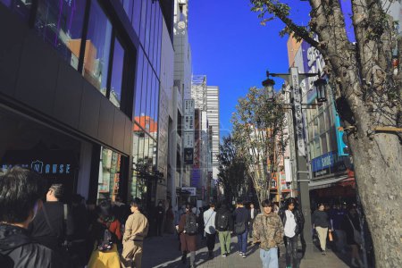 Photo for Shinjuku street sidewalk with people walking on road Nov 28 2023 - Royalty Free Image