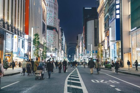 Photo for Japan, Tokyo, Ginza, pedestrian traffic in street, dusk Nov 26 2023 - Royalty Free Image