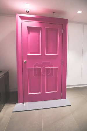 Photo for Jan 20 2024 pink door on white background Valentine day concept - Royalty Free Image