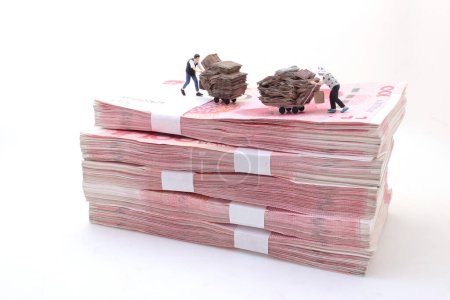 Photo for Collecting boxes and rubbish on Stacks of Chinese Yuan Banknotes - Royalty Free Image