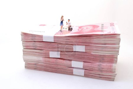 Photo for Marriage proposal on Stacks of Chinese Yuan Banknotes - Royalty Free Image