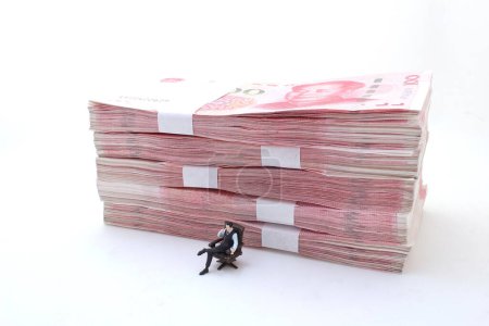 Photo for A boss with Stacks of Chinese Yuan Banknotes - Royalty Free Image