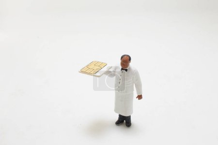 Photo for A figure waiter holding the Sim card - Royalty Free Image