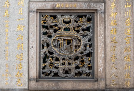 Close-up of ornate art at the landmark Longshan Buddhist Temple in Taipei