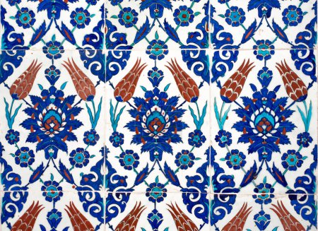 Iznik lapis tiles with tulip pattern on an interior wall of Rustem Pasha Mosque in Istanbul, Turkey. Poster 620442330