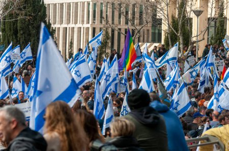 Photo for JERUSALEM, ISRAEL. February 13, 2023. Israeli people with flags protesting against the judicial reform in Jerusalem close to the Knesset. Israel democracy protest editorial image - Royalty Free Image