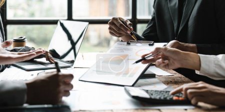 Photo for Business people are meeting for analysis data figures to plan business strategies. Business discussing concept - Royalty Free Image