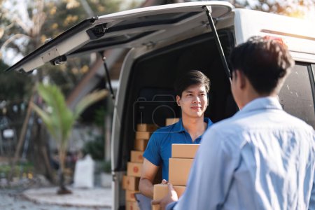 Photo for Home delivery service and working service mind. Man customer hand receiving a cardboard boxes parcel from delivery service courier. delivery logistic concept. - Royalty Free Image