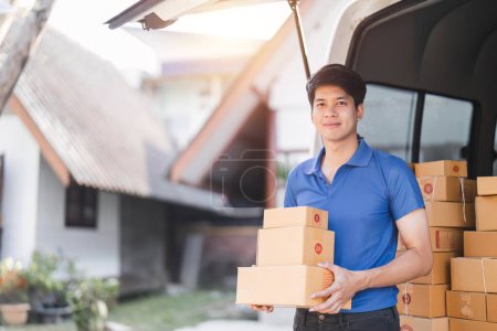 Photo for Smiling delivery asian man standing in front of his van. Portrait of courier delivering parcel package. - Royalty Free Image