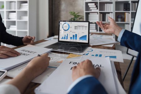 Photo for Business team discussing working analyzing with financial data and marketing growth report graph in team, presentation on laptop in office. - Royalty Free Image