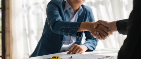 Photo for Handshake of cooperation customer and salesman after agreement, successful car loan contract buying or selling new vehicle. - Royalty Free Image