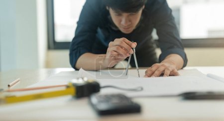 Photo for Engineer planing and working on table construction working at office. - Royalty Free Image