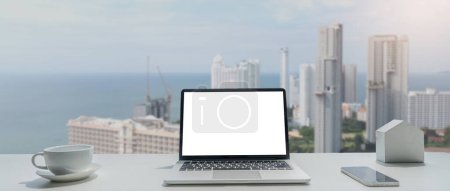 Photo for Image of working space by the window equipment in office interior, open laptop computer with mock up screen. - Royalty Free Image
