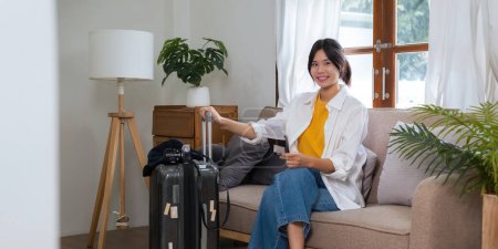 Photo for Portrait of beauty asian traveler woman pack prepare stuff and outfit clothes in suitcase travel bag luggage for summer, holiday, weekend, tour, journey, vacation trip at home. - Royalty Free Image