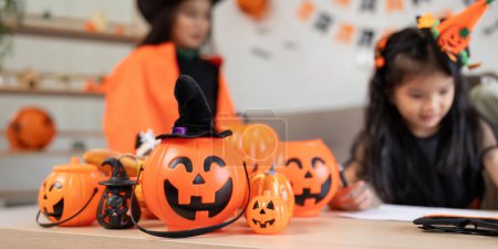 Photo for Halloween concept mom and daughter preparing to celebrate at home together beautifully decorated. - Royalty Free Image