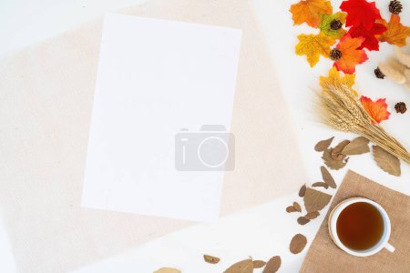 Photo for Modern office desk with coffee cup, notebook, yellow-red autumn leaves on white background with copy space. Place for your text. Work table with office supplies. concept cosy, cozy, seasonal autumn. - Royalty Free Image