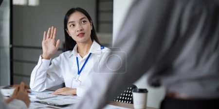 Photo for Asian business team meeting to analyze and discuss the situation on the financial report in the meeting room. Investment Consultant, Financial advisor and accounting concept. - Royalty Free Image