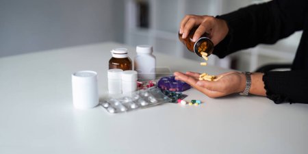 Photo for Women organize check the medicine bottle her medication into pill dispenser. female taking pills from box. Healthcare and concept with medicines. medicaments on table. - Royalty Free Image