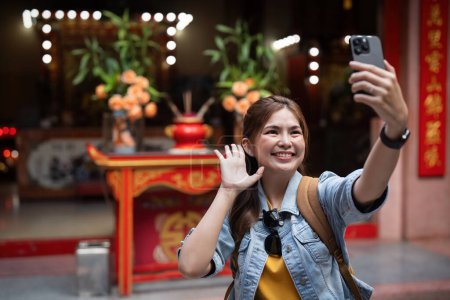 Photo for Young beautiful woman asian traveler with smartphone taking selfie travel at market in Thailand. - Royalty Free Image