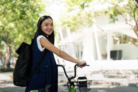 Photo for Eco friendly, Happy lifestyle asian beautiful young businesswoman riding bicycle go to office work at city street with bicycle in morning. - Royalty Free Image