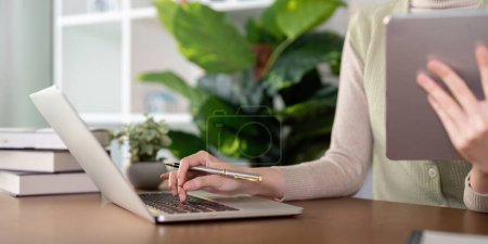 Photo for Woman creative in home office and laptop for research in remote work, social media or blog in home office. Freelance at desk with computer writing email, website post and online chat in house. - Royalty Free Image
