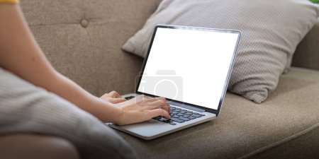 Photo for Young female with laptop at home on white blank screen for montage mockup display device in concept of lifestyle work at home. - Royalty Free Image