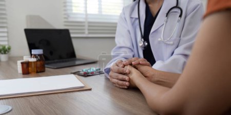 Photo for Doctor holding patient hand cheer and encourage while checking your health. - Royalty Free Image