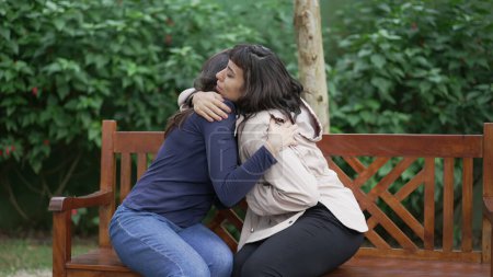 Photo for Sympathetic female friend in SUPPORT with suffering woman. Person in sorrow embracing supportive companion - Royalty Free Image