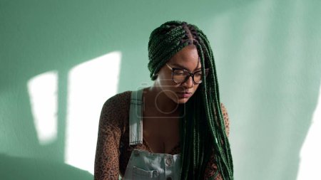 Photo for Preoccupied young African American adult girl with box braids. One worried stressed thoughtful female black girl reflecting decision. Dilemma emotion - Royalty Free Image