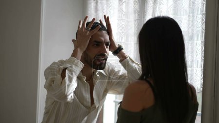 Photo for Young Couple Arguing and Fighting. Emotional abuse Scene, Stressed Woman and frustrated Man Screaming at Each other by window at home. Dramatic Scene - Royalty Free Image