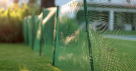 Photo for Garden fences separating home backyard - Royalty Free Image