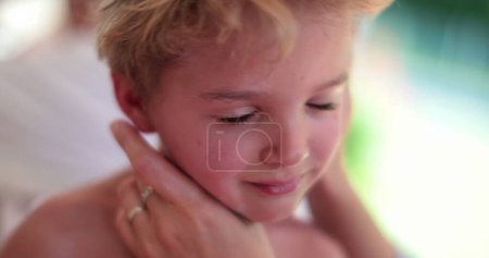 Photo for Mom applies sunscreen lotion to child face - Royalty Free Image
