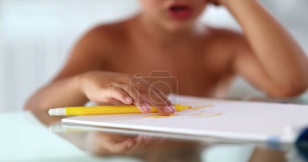 Photo for Close-up child hand drawing and coloring on paper - Royalty Free Image