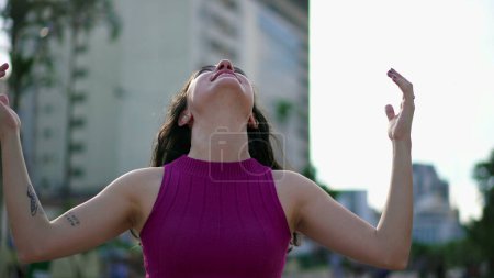 Photo for Grateful young woman putting hands in chest having HOPE and FAITH. Joyful female person in 30s in contemplation. Mindful expression - Royalty Free Image