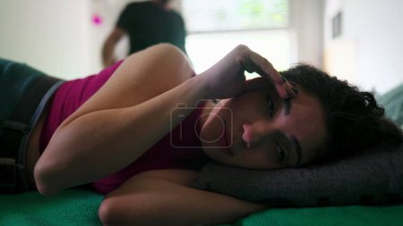 Photo for Bedroom Dispute. Dismissive Wife Rolls Her Eyes as angry Husband Gestures in background During Relationship Crisis - Royalty Free Image