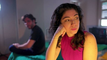 Photo for Dismissive young woman ignoring male partner during relationship argument. Couple feeling disconnected and in the verge of a break up - Royalty Free Image
